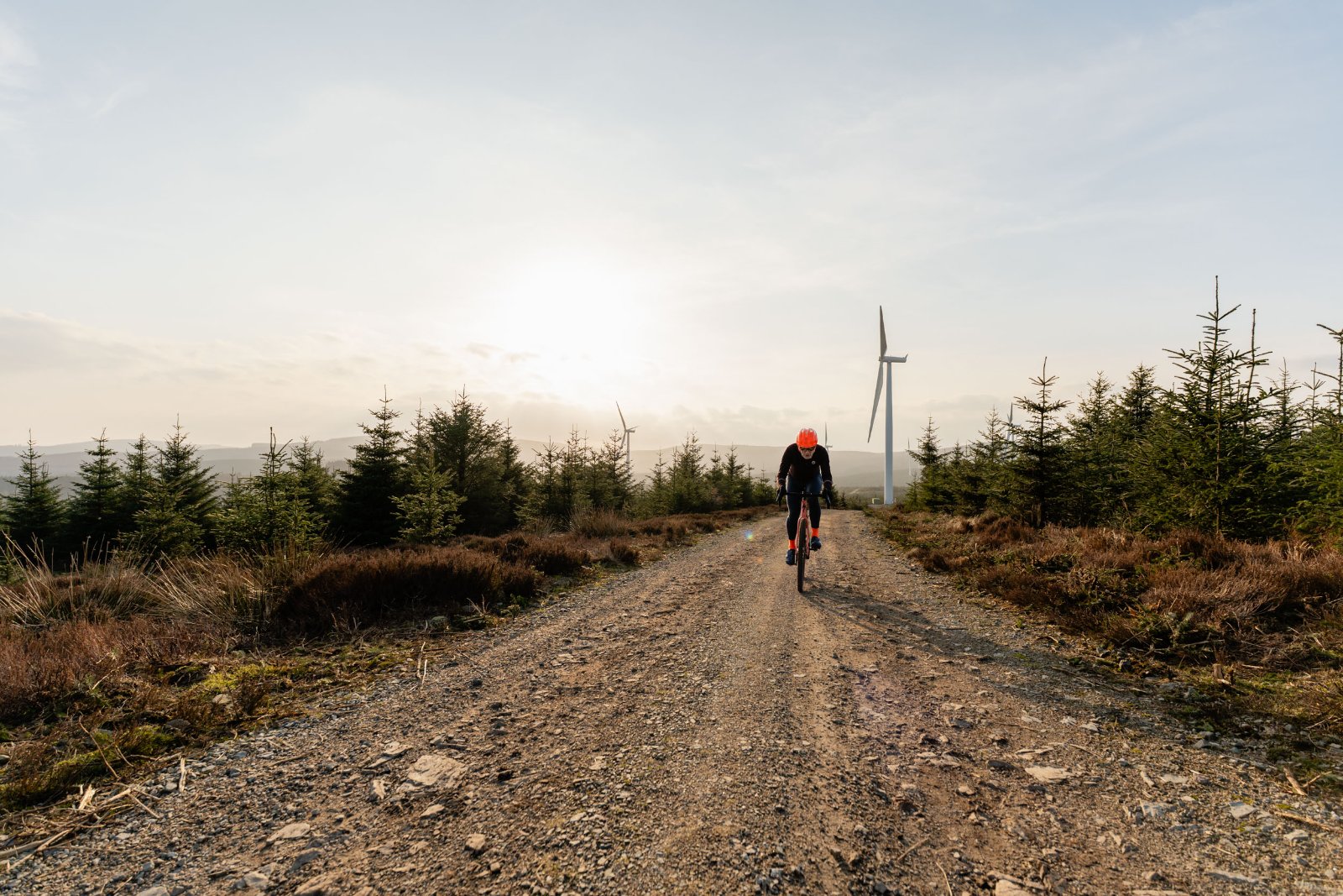 Rider descending a gravel track in Royal Deeside
